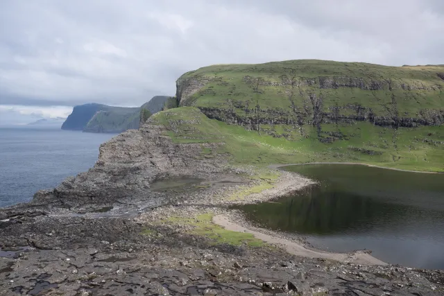 Lake Leitisvatn, which flows over a waterfall into the North Atlantic